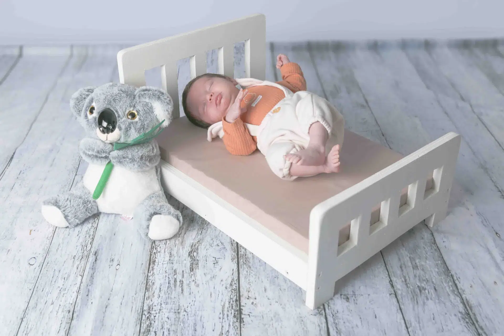 Bridge And Groom Standing While Holding Flower Bouquet