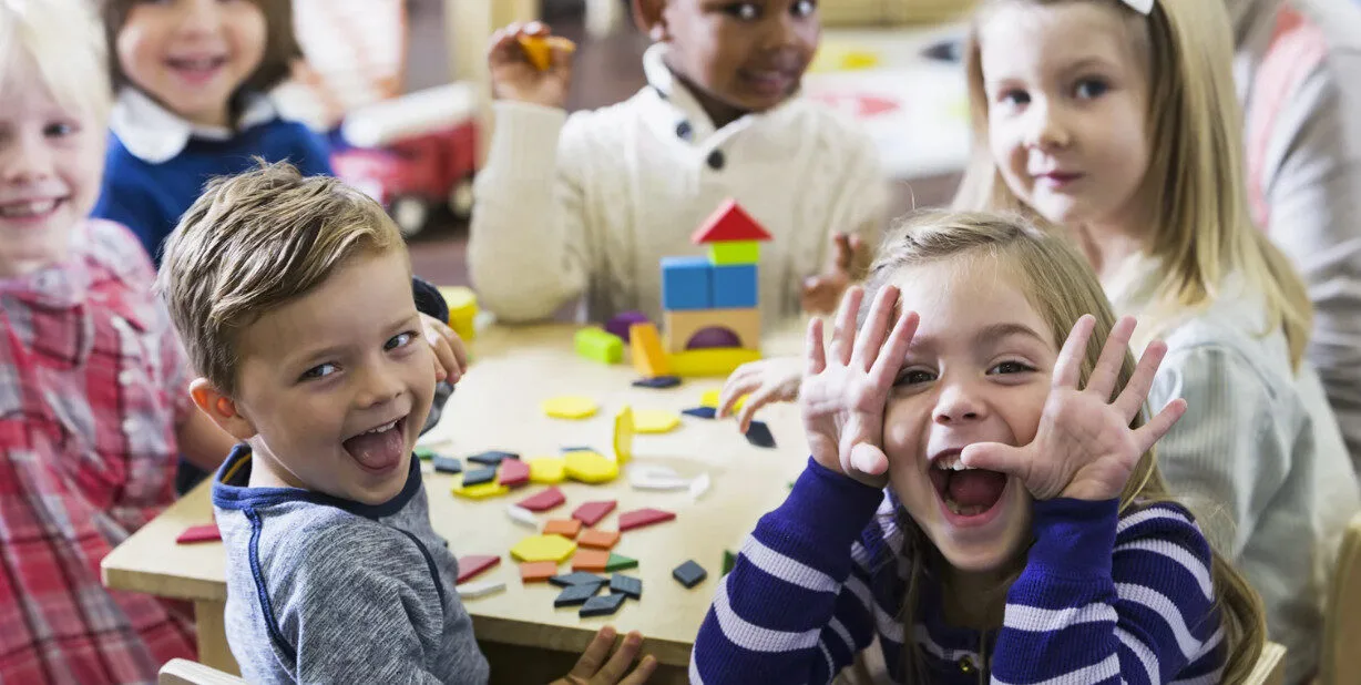 Bridge And Groom Standing While Holding Flower Bouquet